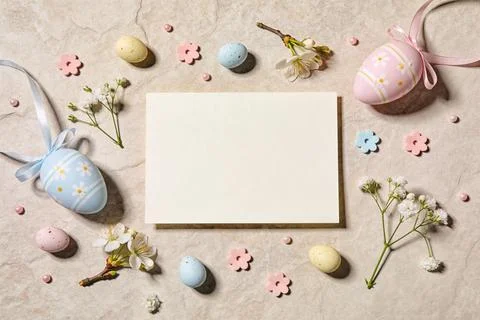 Easter holiday flat lay with decorated eggs, spring blossoms, and blank car.. Stock Photos