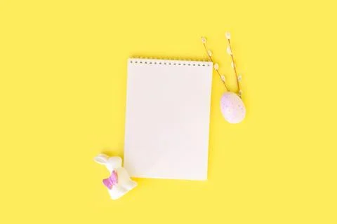 Easter holiday flat lay with notebook mock up with painted colorful eggs, rabbit Photos