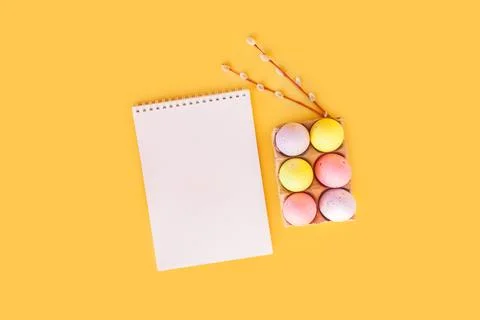 Easter holiday flat lay with notebook mock up with painted colorful eggs, rabbit Stock Photos