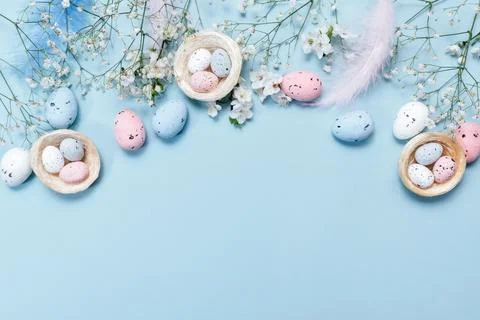 Easter Holiday Invitation Design with Easter Eggs and Feathers Stock Photos