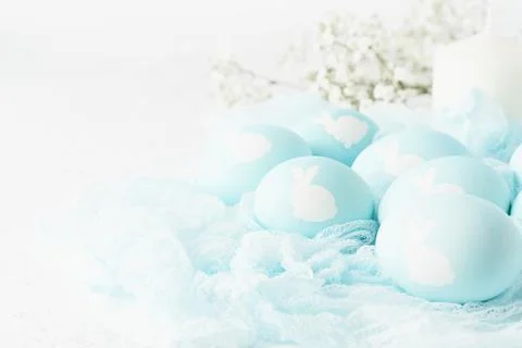 Easter. Holiday. Light white background, gentle pastel colors. Blue eggs with Stock Photos