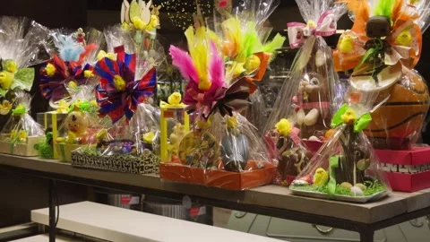 Easter holiday sets of chocolate eggs and bunnies are on the shelves in the Stock Footage 327855099
