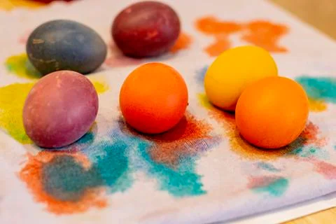 Easter holiday.colored eggs are on the table at the time of painting Stock Photos