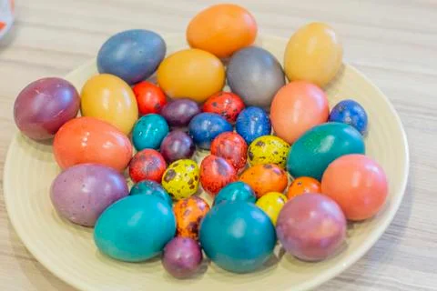 Easter holiday.colored eggs are on the table at the time of painting Stock Photos