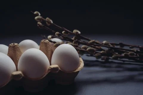 Easter holidays concept. Close up composition of white easter eggs in carton box Stock Photos