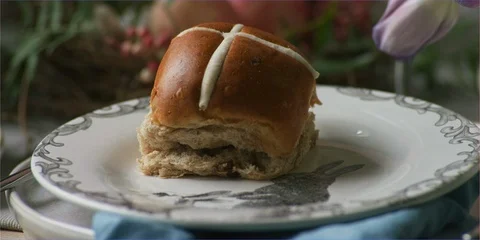 Easter hot cross buns on table in daylight, cute animal Stock Footage 106267531