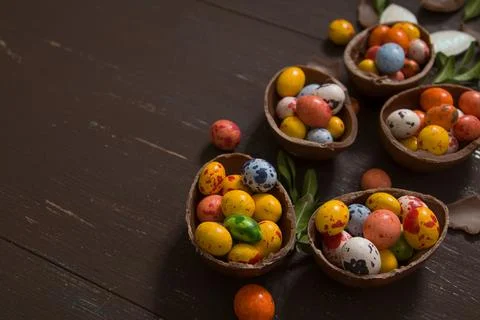 Easter hunt background with chocolate eggs on wooden backround copy space Stock Photos