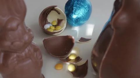 Easter Joy: Chocolate Eggs Cracked Open to Reveal Sweet Surprises Stock Footage 332944269