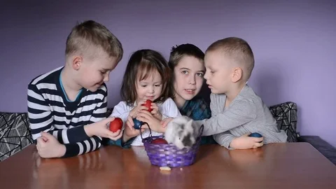 Easter, kids are playing with Easter eggs and share them Stock Footage 78992015