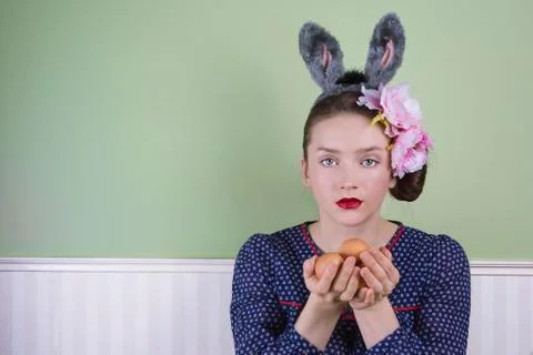 Easter lady holding eggs Stock Photos
