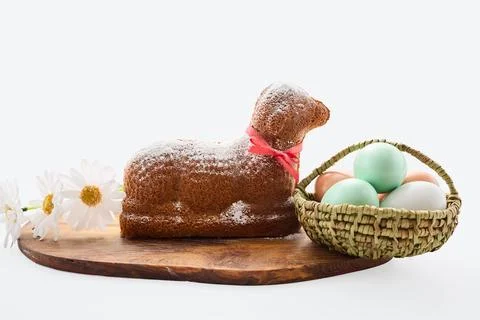 Easter lamb cake with colored eggs and flowers Stock Photos