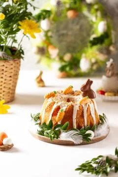 Easter lemon cake with icing and easter decoration. Easter gugelhupf cake wit Stock Photos