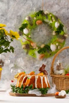 Easter lemon cake with icing and easter decoration. Easter gugelhupf cake wit Stock Photos