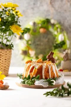 Easter lemon cake with icing and easter decoration. Easter gugelhupf cake wit Stock Photos