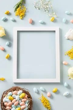 Easter mock up with chocolate eggs on blue background. Stock Photos