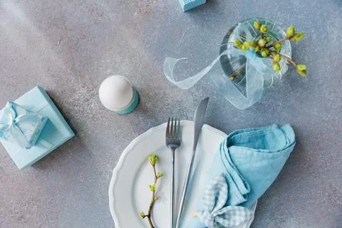 Easter Morning Table Setting with Gifts and Egg Стоковые фото