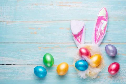 Easter multi-colored eggs and rabbit ears. Flat lay Stock Photos
