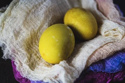 Easter. Natural dyed eggs and cheese cloths. Close up Stock Photos