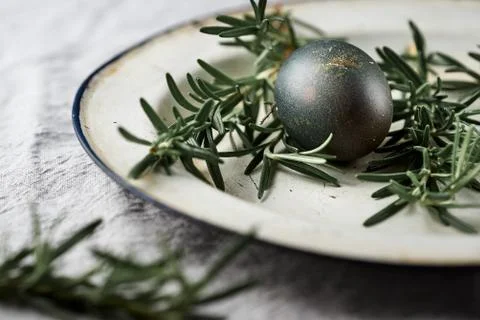 Easter. Naturally colored egg background. Selective focus on vintage plate wi Stock Photos