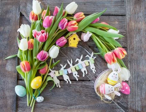 Easter nest with tulips Stock Photos