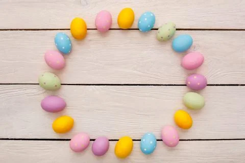 Easter objects eggs isolated on wooden background top view circle form Stock Photos