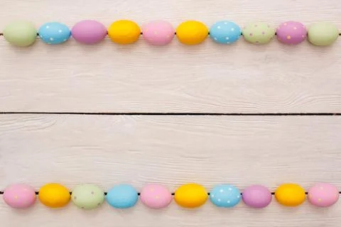 Easter objects eggs isolated on wooden background top view horizontal rows Stock Photos