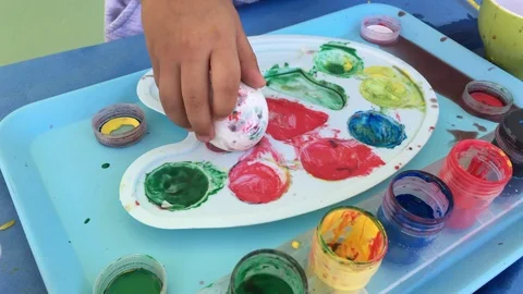 Easter. Paint eggs with baby Stock Footage 101805429