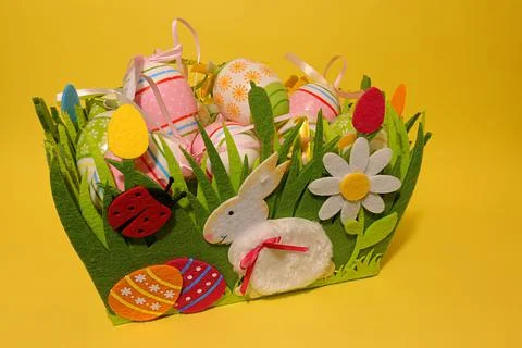 Easter, painted easter eggs, in front is bunny and a ladybug. Stock Photos