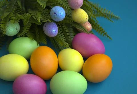 Easter painted eggs on a blue background. Bright postcard, copy space Stock Photos