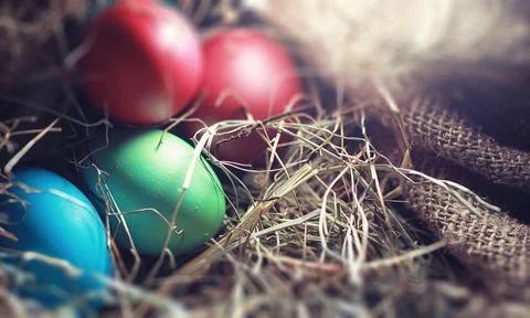 Easter painted eggs on burlap 스톡 사진