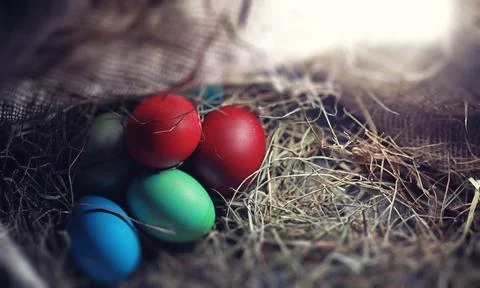 Easter painted eggs on burlap 스톡 사진