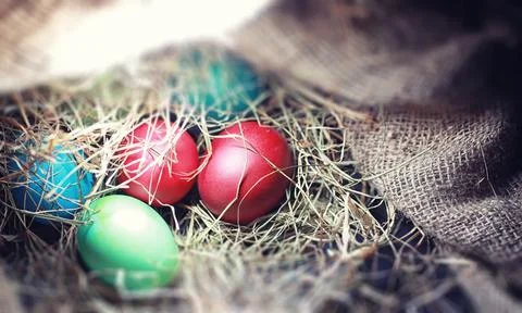 Easter painted eggs on burlap Stock Photos
