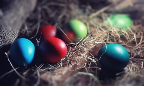 Easter painted eggs on burlap 스톡 사진