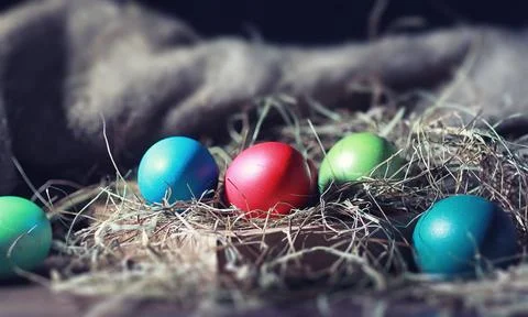 Easter painted eggs on burlap 스톡 사진