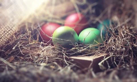 Easter painted eggs on burlap 스톡 사진