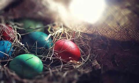 Easter painted eggs on burlap 스톡 사진