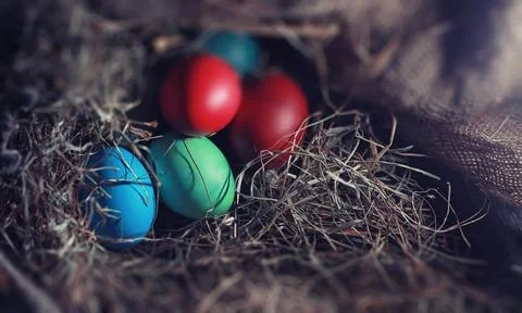 Easter painted eggs on burlap 스톡 사진
