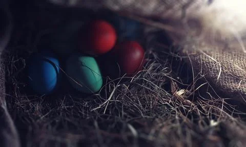 Easter painted eggs on burlap 스톡 사진