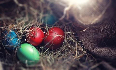 Easter painted eggs on burlap 写真素材
