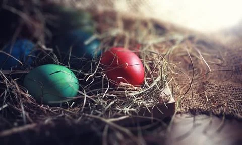 Easter painted eggs on burlap 스톡 사진