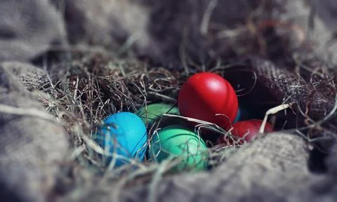Easter painted eggs on burlap 스톡 사진