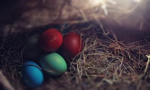 Easter painted eggs on burlap 스톡 사진