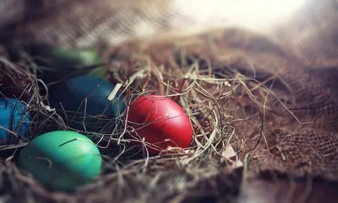 Easter painted eggs on burlap 스톡 사진