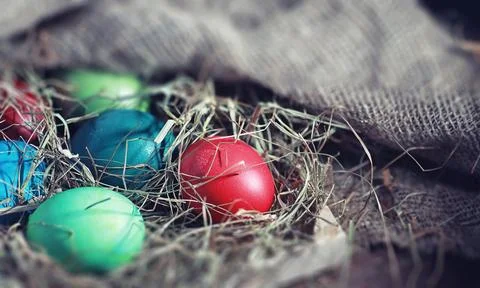 Easter painted eggs on burlap Stock Photos