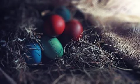 Easter painted eggs on burlap 스톡 사진