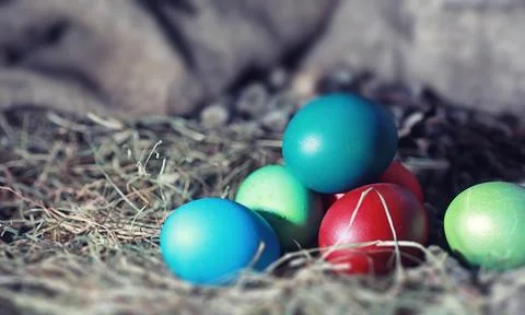 Easter painted eggs on burlap 스톡 사진