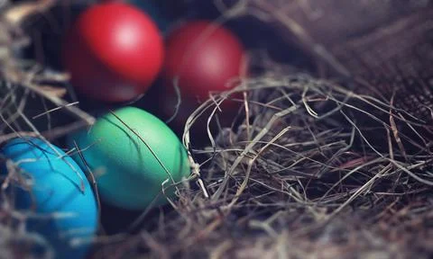 Easter painted eggs on burlap 스톡 사진