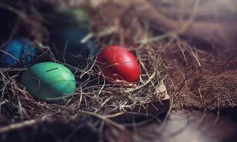 Easter painted eggs on burlap 스톡 사진