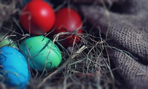 Easter painted eggs on burlap 스톡 사진