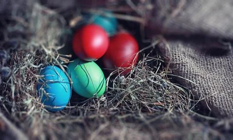 Easter painted eggs on burlap Stock Photos